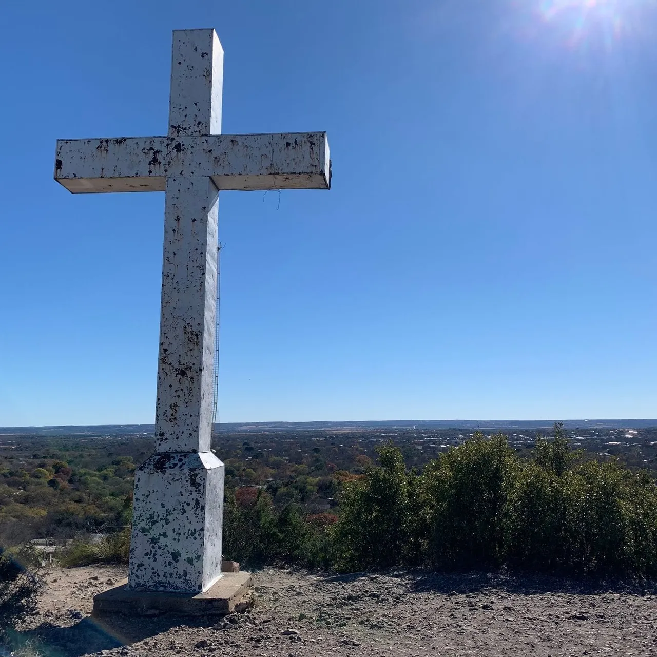 Cross Mountain rising above the town of Fredericksburg, Texas