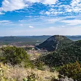 Old Baldy mountain rising above the Frio River at Garner State Park