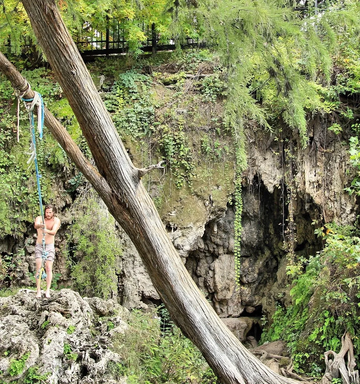 The grotto and rope swing at Krause Springs near Spicewood, Texas