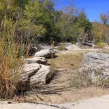 Rock stepping stones used for creek crossing on a hiking trail at Lost Maples